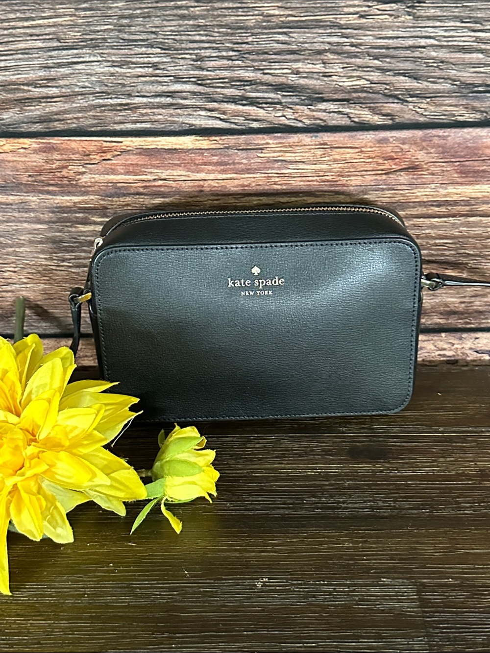kate spade black leather crossbody bag with gold logo